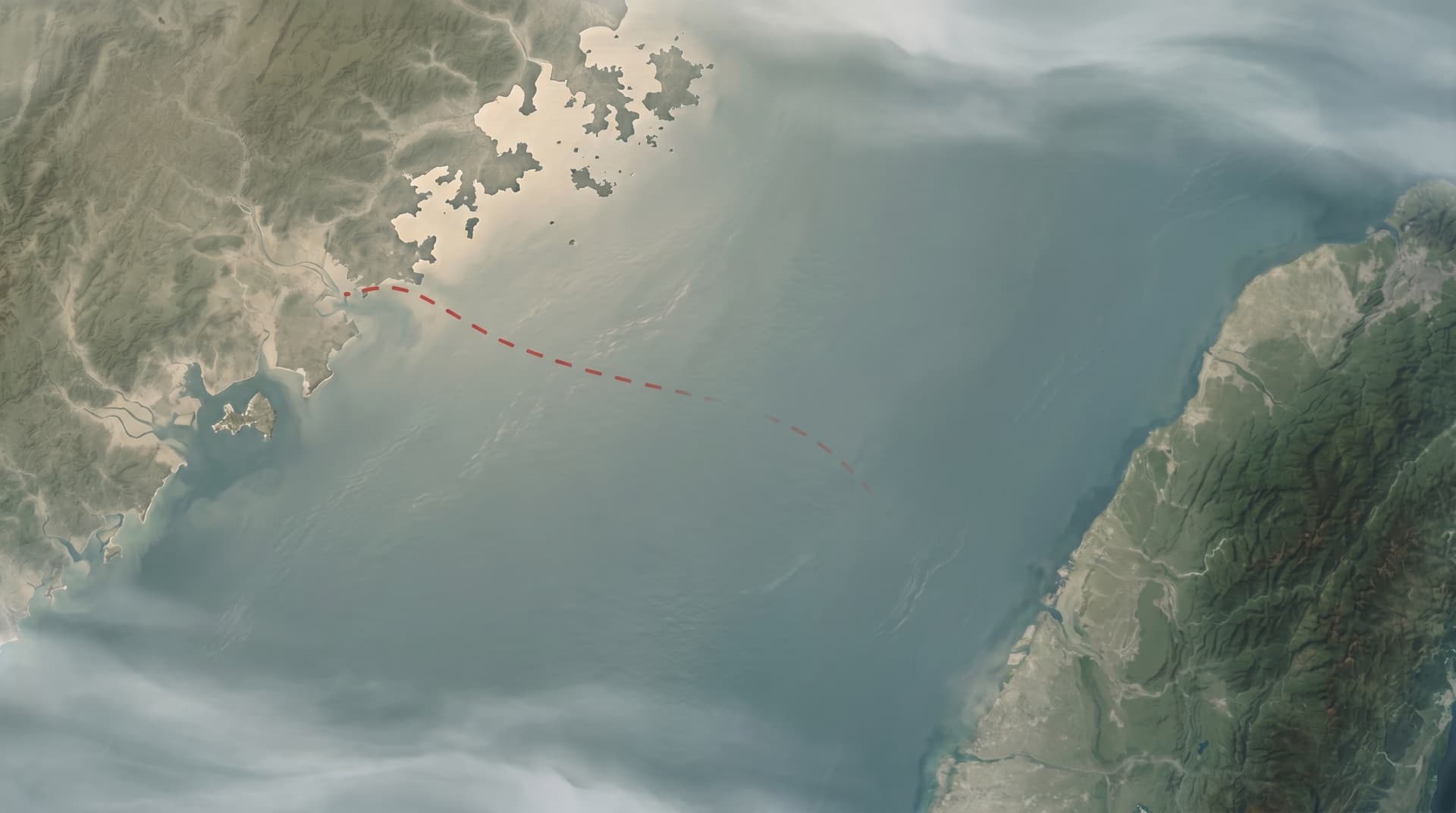 Satellite view of the Taiwan Strait with a dashed red line between mainland China and Taiwan marking a border neither side will admit exists